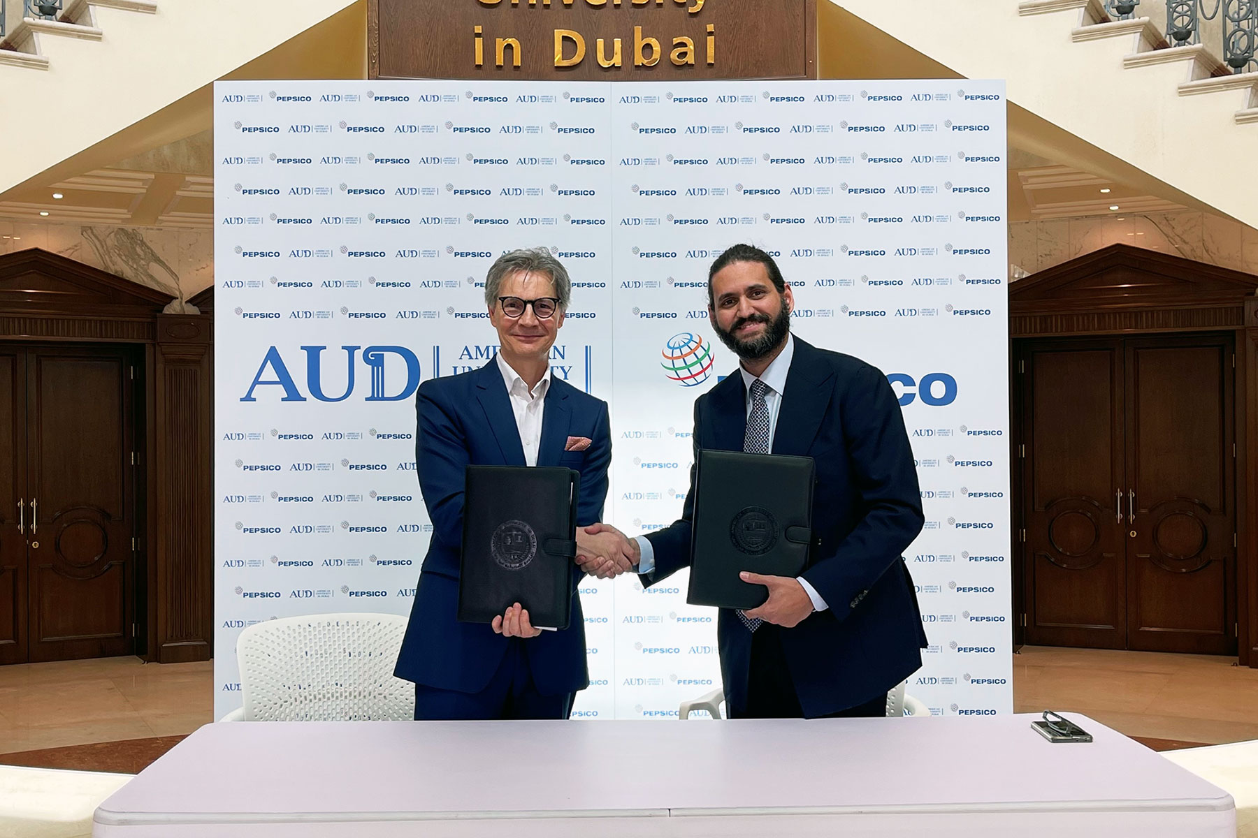 A cooperative agreement between "AUD" and "PepsiCo," to focus on sustainability